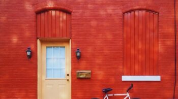 A door with a bike beside it